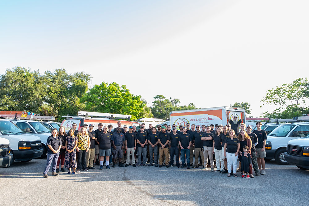 The Ace Electric team with their service vehicles in Sarasota